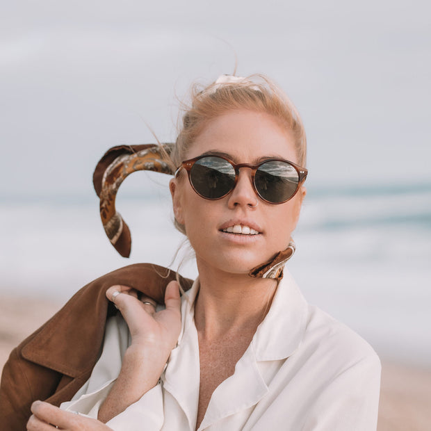 Mari & Clay, Australian sustainable sunglasses label. The Goulburn style is an oval, lightweight design available in black, sand (clear), tortoiseshell, and caramel bio-acetate frames. All Mari & Clay sunglasses are fitted with polarised lenses. The design is unisex and good for oval, square and heart-shaped faces.