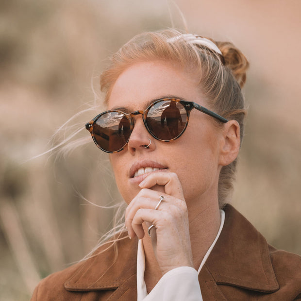 Mari & Clay, Australian sustainable sunglasses label. The Goulburn style is an oval, lightweight design available in black, sand (clear), tortoiseshell, and caramel bio-acetate frames. All Mari & Clay sunglasses are fitted with polarised lenses. The design is unisex and good for oval, square and heart-shaped faces.