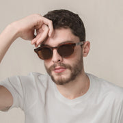 Mari & Clay, Australian sustainable sunglasses label. The Murray style is a round design available in black, sand (clear), tortoiseshell, and caramel bio-acetate frames. All Mari & Clay sunglasses are fitted with polarised lenses. The design is unisex and good for oval, square and heart-shaped faces.