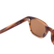 Mari & Clay, Australian sunglasses brand with sustainable sunglasses. Glenelg style is rectangular in shape. It is available in a caramel colour frame and fitted  with dark brown polarised lenses. It is unisex design and good for oval, long and round face shapes.   