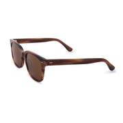 Mari & Clay, Australian sunglasses brand with sustainable sunglasses. Glenelg style is rectangular in shape. It is available in a caramel colour frame and fitted  with dark brown polarised lenses. It is unisex design and good for oval, long and round face shapes.   